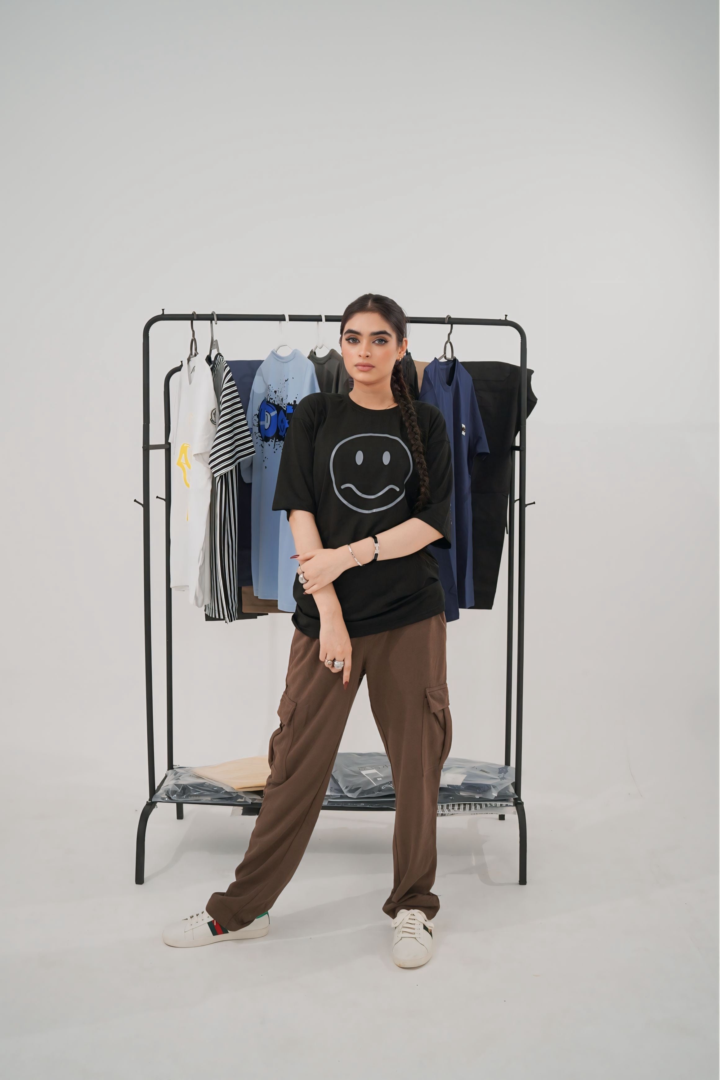 Trendy baggy trousers paired with crop top and sneakers