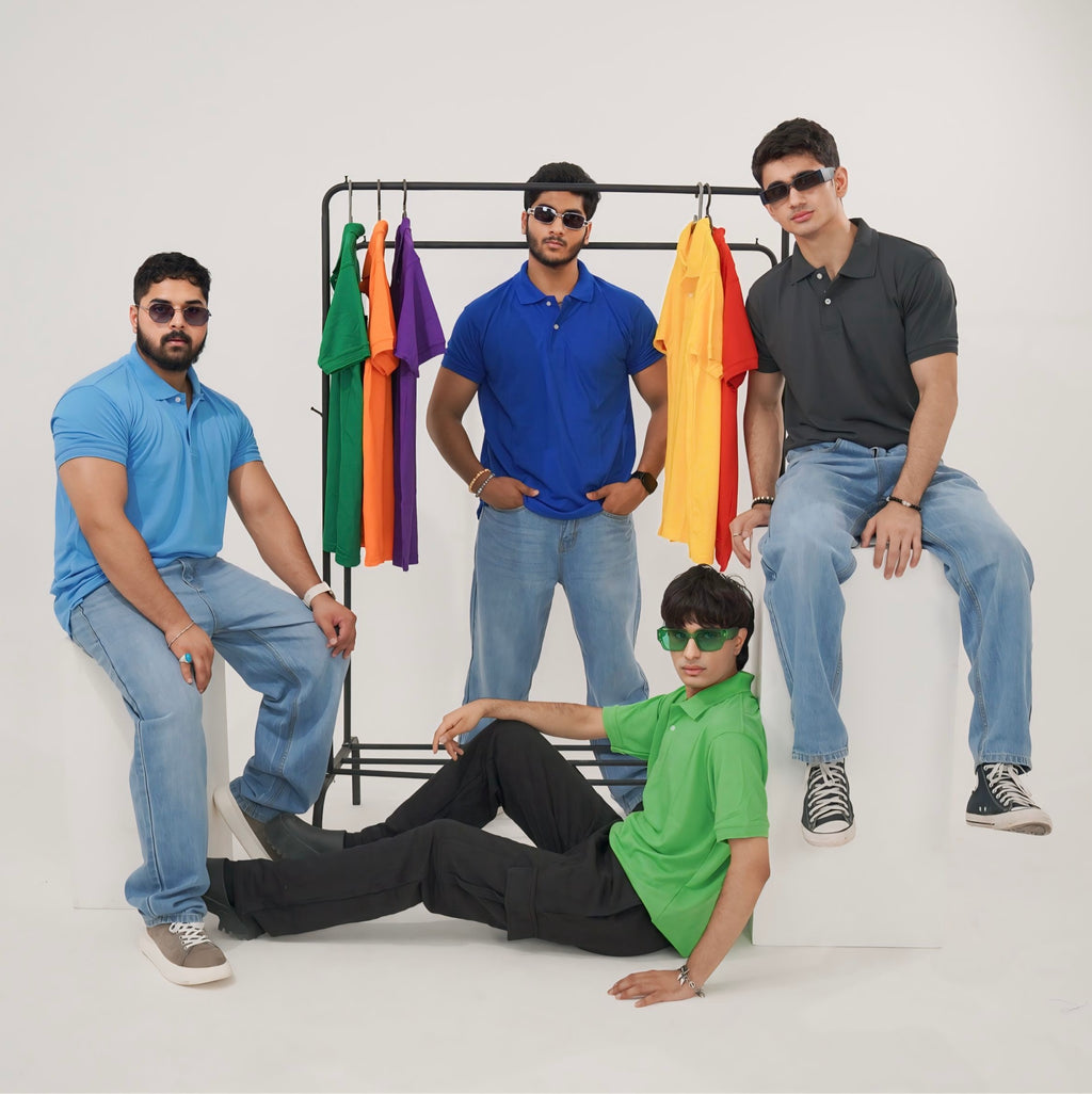 Four men posing with colorful polo on a rack against a white background
