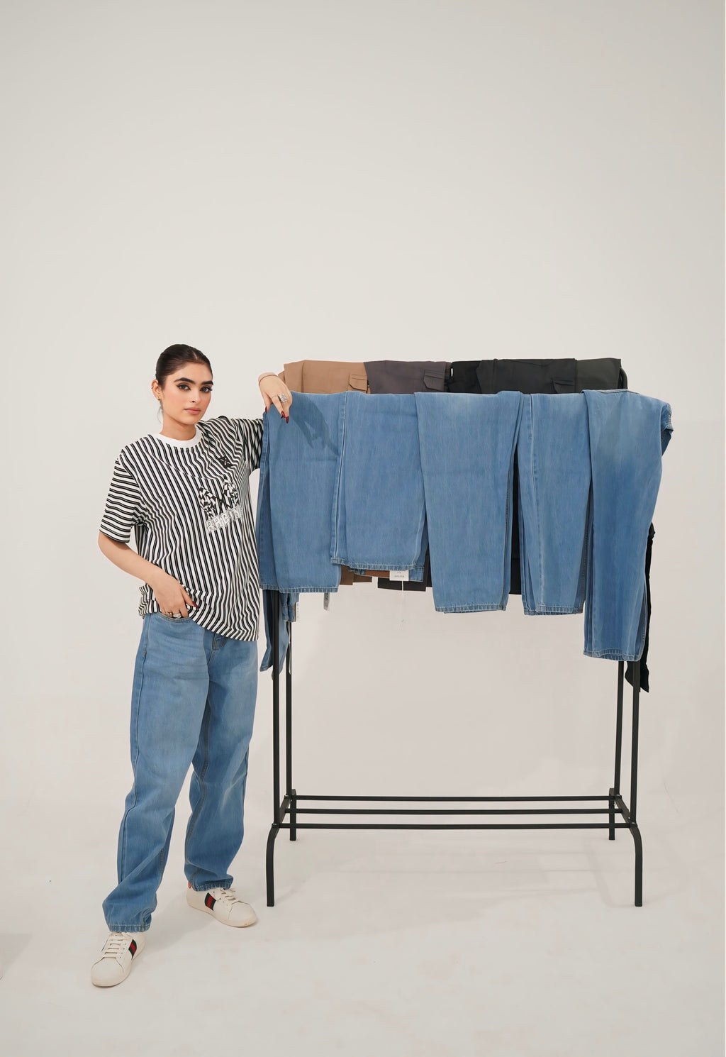 Trendy oversized baggy jeans paired with white sneakers